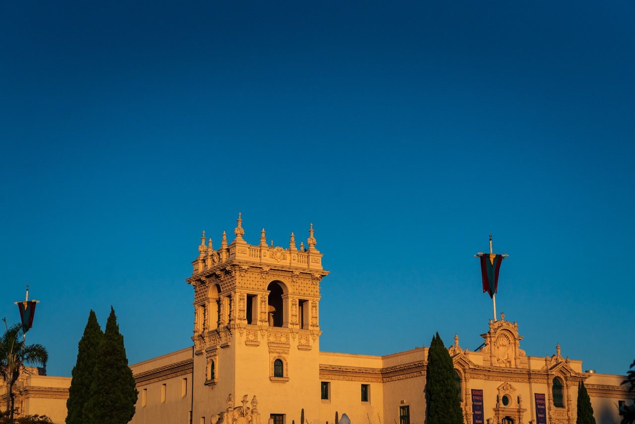 The ornate tower of a Spanish Colonial building in Balboa Park at golden hour